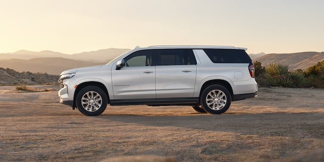 The Iridescent Pearl Tricoat 2024 Chevy Suburban Parked in the Desert