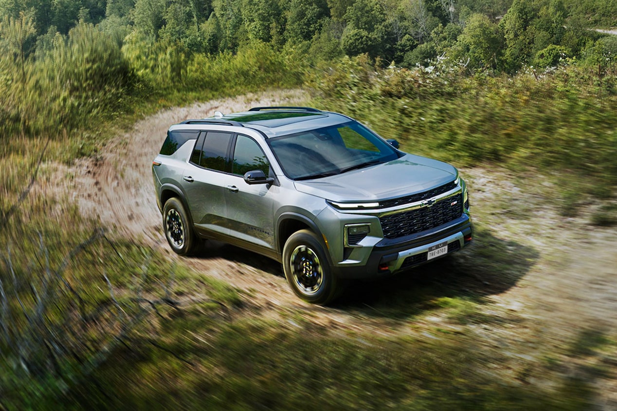 2024 Chevy Traverse Driving Off-Road on a Tree-Lined Path