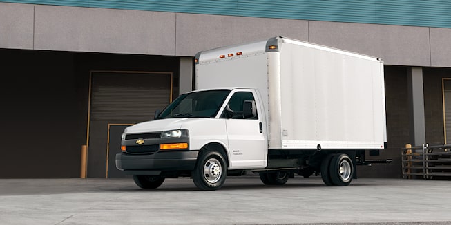 2024 Chevy Express Cargo Van Parked with a City Backdrop