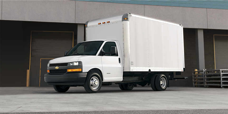 2024 Chevy Express Cargo Van Parked with a City Backdrop