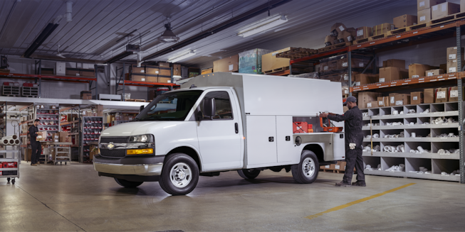 Man Unloading Boxes From His 2024 Chevy Express Cargo Van